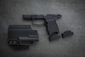 Juggernaut JT P365 Grip Module Anodized Black with two 10‑rd XL base plates and Talon IWB holster