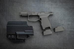 Juggernaut JT P365 Grip Module anodized dark grey with two 10-round XL base plates and Talon IWB holster