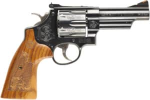 Smith & Wesson Model 29 machine engraved blued 4-inch .44 Magnum revolver with engraved wood grips