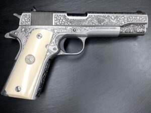 Colt CLT 1911 DINOSR MTRTE 45AP 5SS pistol angled view